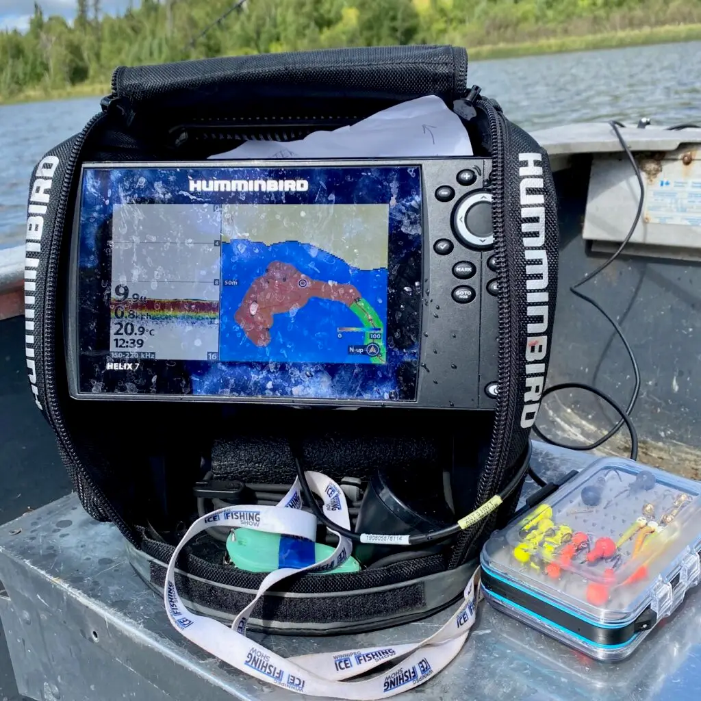 A fish finder sitting on top of a boat.